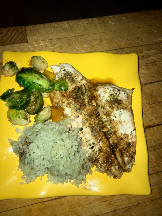 Meyer lemon sole with blueberry balsamic glaze on a plate